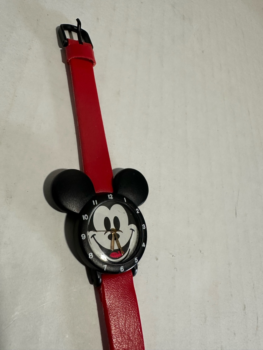 Vintage Lorus Mickey Mouse watch featuring an ear shaped black case